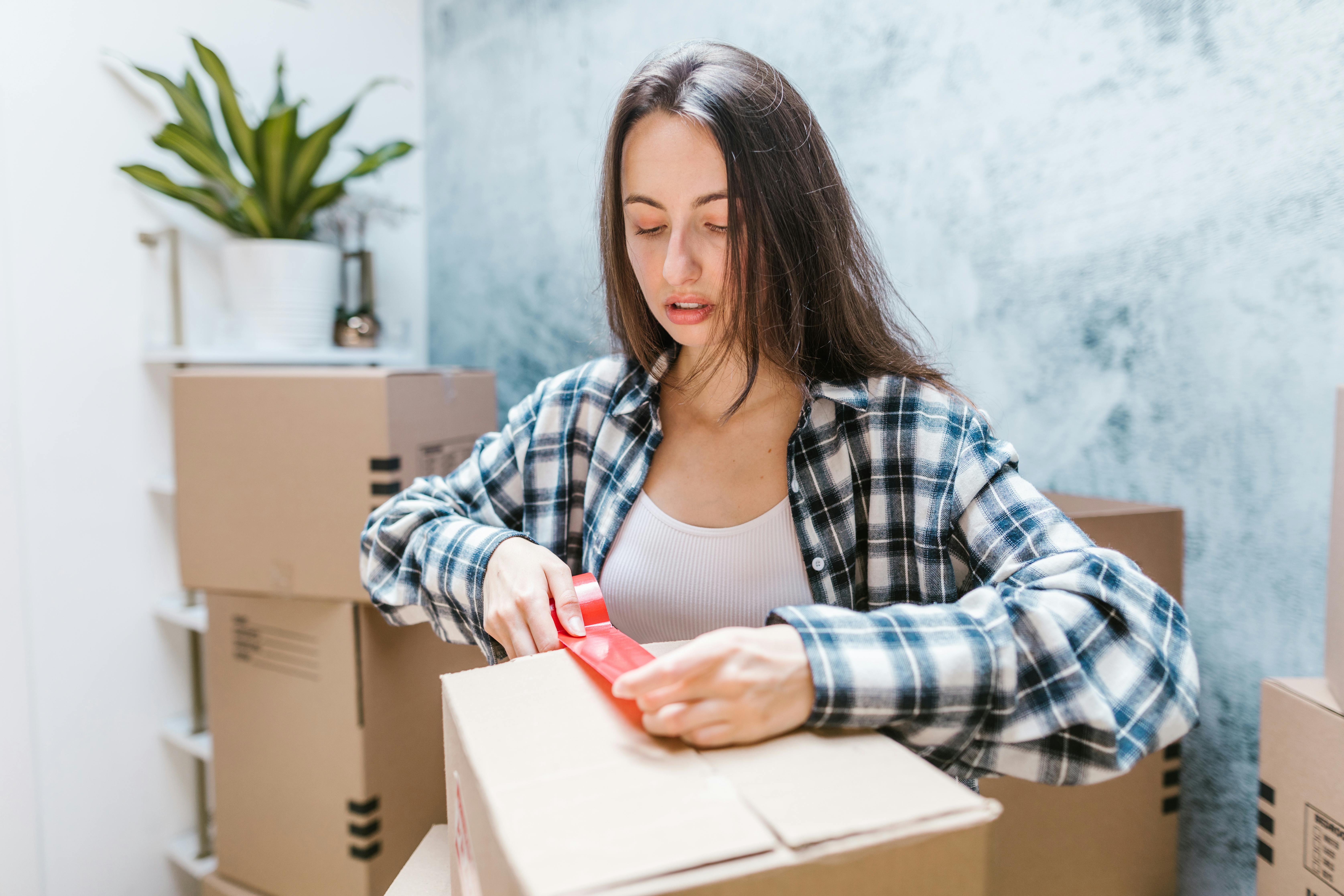 Woman Packing Boxes